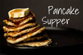 "pancake supper" - a stack of pancakes dripping with syrup and topped by a large pat of butter